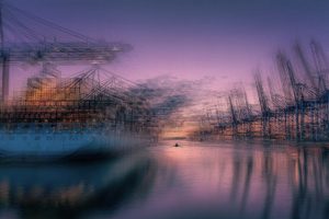 Painterly scene of a tiny boat next to a container ship in the terminal Burchardkai in Hamburg at sundown, Hamburg, Germany